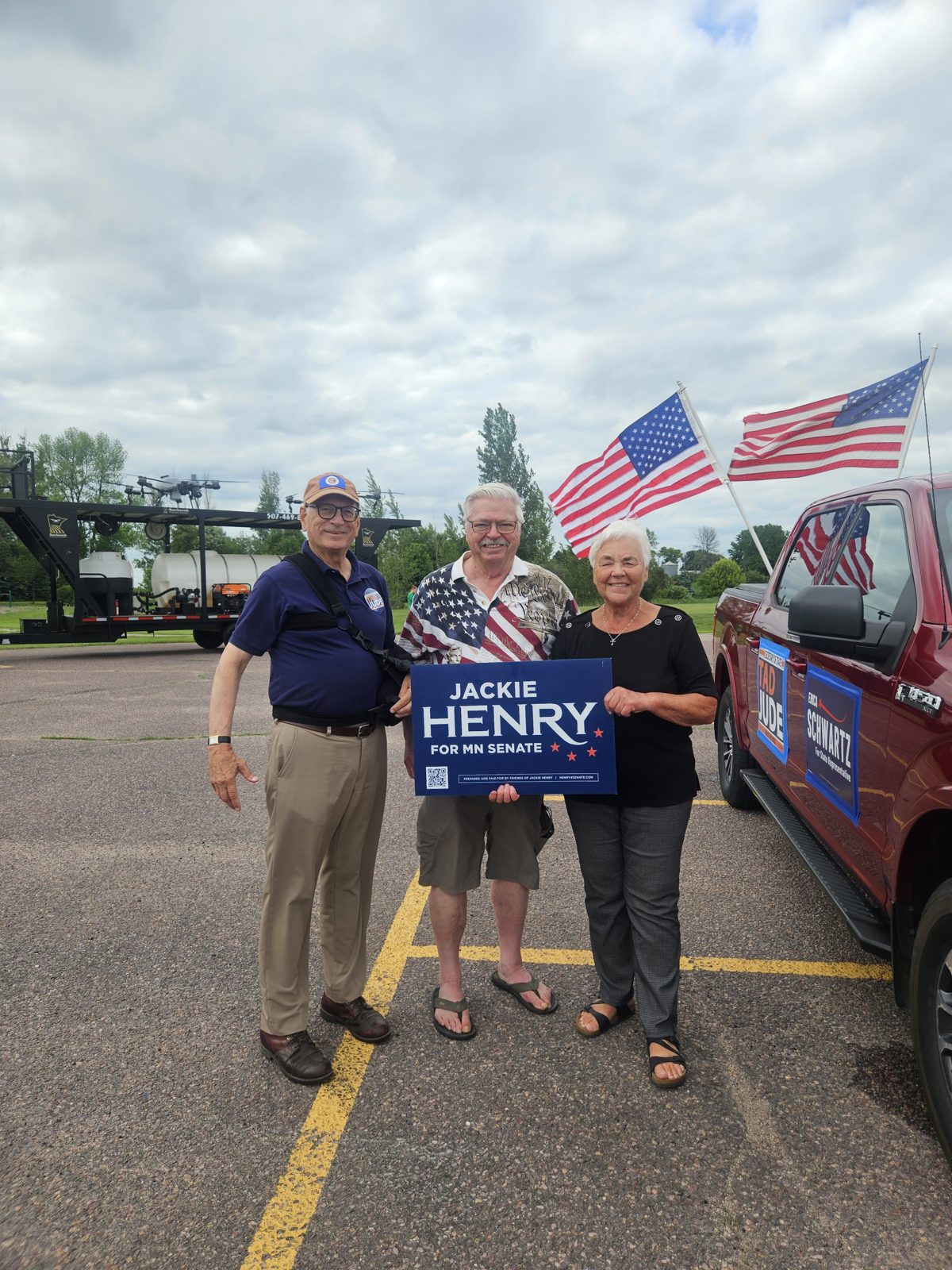 Jackie Henry with Ted Jude and Nicollet Mayor Fred Froehlich at her campaign sign during the Nicollet Friendship Days parade