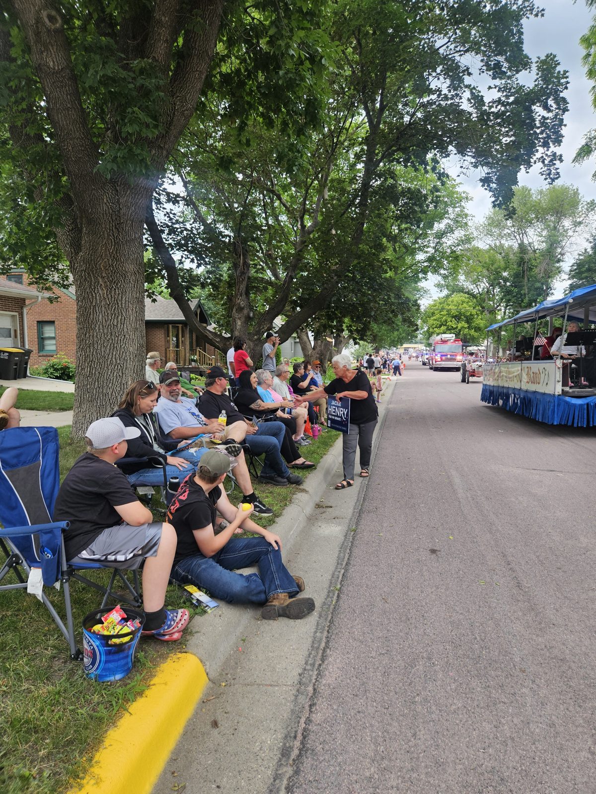 Neighbors lining the street to watch the Nicollet Friendship Days parade